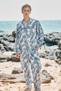 Model wearing MANITO Ocean Blue Men's Pajama Set, featuring long sleeves and a relaxed fit.