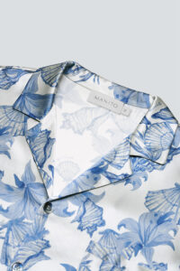 Close-up of MANITO pajama set's lapel and collar, highlighting intricate ocean blue floral design.