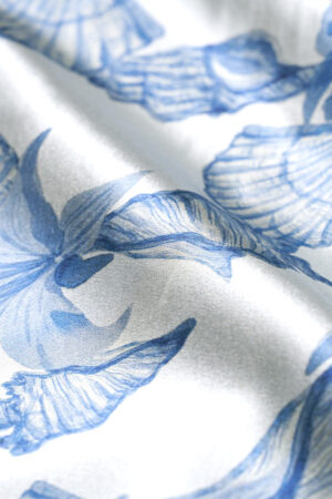 Macro shot of the silk fabric of MANITO Ocean Blue Men's Pajama Sets, emphasizing its delicate sheen and breathable texture.
