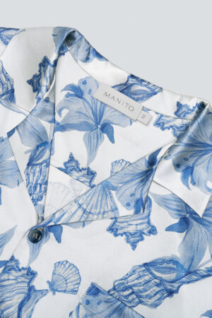 A close-up of MANITO Ocean Blue Men's Silk Short Pajama Set, highlighting its elegant blue floral print.
