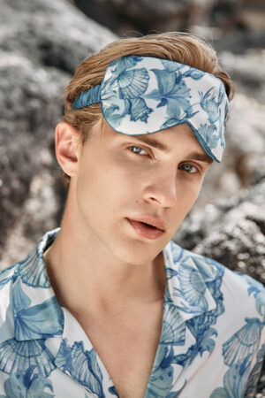 Front view of Ocean Blue Men's Silk Eye Mask, showcasing the hand-painted ocean floral patterns on 22 momme mulberry silk.