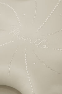 MANITO cream Ocean Starfish Throw Pillow featuring elegant pearl details and embroidered logo.