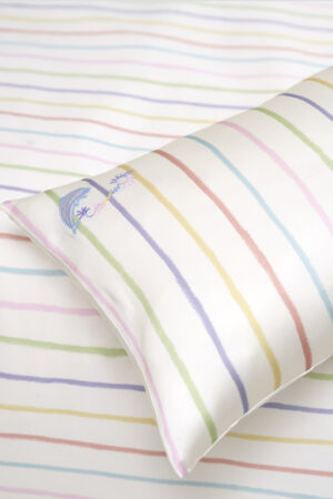 Detailed view of the silk pillowcase from MANITO Ocean Stripe baby crib bedding set.