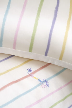 Embroidery detail on the MANITO Ocean Stripe baby crib bedding set, featuring a delicate sun and wave motif.