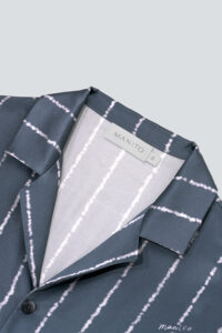 Close-up of MANITO Ocean Stripe Men's Pajama Set collar with contrast inner lining and branded label for detailed craftsmanship.