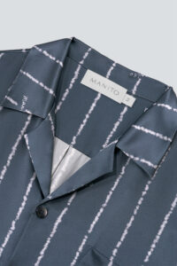 Close-up of the collar tag on the MANITO Ocean Stripe Men's Short Pajama Set shirt.
