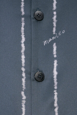 Detail of buttons and MANITO embroidery on MANITO Ocean Stripe Men's Short Pajama Set.