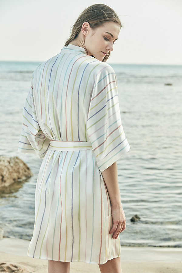 Back view of MANITO Ocean Stripe Silk Short Robe, featuring soft pastel stripes and a comfortable belt tie.