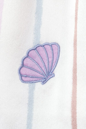 Close-up of the shell embroidery on the MANITO shorts, enhancing the elegant design.