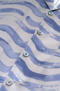 Detail of button placket on MANITO Ocean Wave Men's Short Pajama Set shirt.