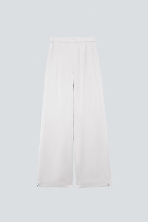 Flat lay of MANITO Passion Women's Silk Trousers in white, presenting elegant drape and smooth texture.