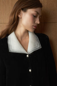 Side view of woman in Poetic Tulle Collar Velvet Pajama Set, focusing on the delicate tulle collar and plush velvet texture.