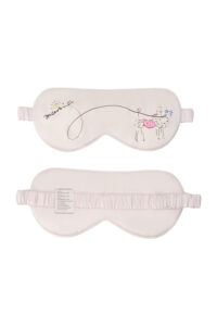 Puppy Silk Eyemask in pink decorated with a fluffy poodle and a gentle looping leash graphic, shown front and back for detail.