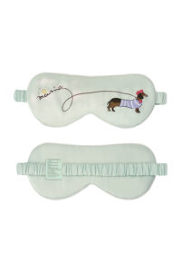 Puppy Silk Eyemask in green featuring a dachshund and a long leash drawing a relaxed logo curve, front and back view.