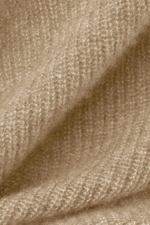 Close-up of Purity Knit Balaclava fabric, revealing the plush ribbed knit and airy, brushed texture.