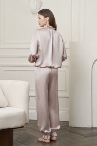 Back view of the Purity Silk Women's Drawstring Set, displaying the relaxed fit and soft sheen of the lotus-pink silk.