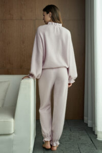 Back view of woman in lavender Purity Drawstring Set, capturing the soft drape and cozy comfort of the fabric.