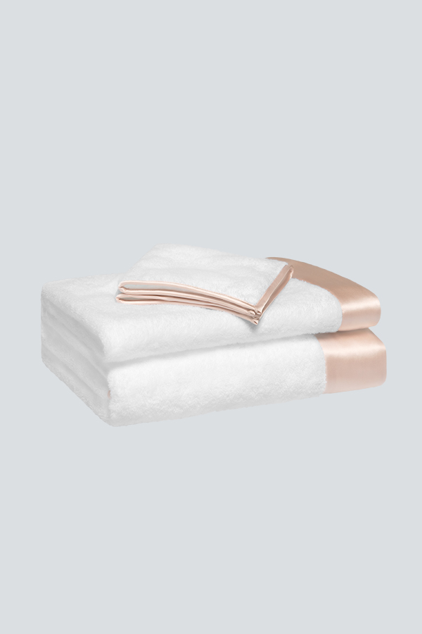 MANITO Brimmy 3 Piece Bath Towel Set with blush-pink silk trim, including a bath towel, hand towel, and washcloth.