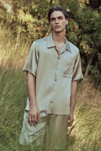 MANITO Remington Men's Short Pajama Set in ginkgo color styled outdoors in tall grass.