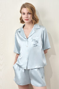 MANITO Remington Women's Silk Short Pajama Set in light blue shown front-facing on model.