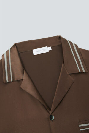 Close-up of brown MANITO Ribbon pajama collar with double stripe design.