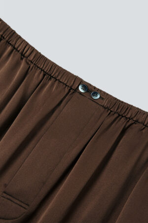 Elastic waistband with double button closure on brown MANITO Ribbon pajama pants.