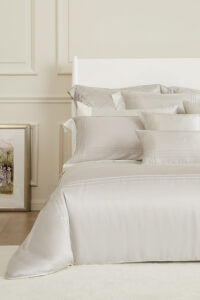 MANITO Ripple Bedding Set displayed on a neatly made bed with matching pillowcases.