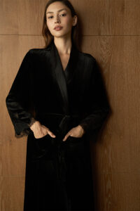 Model wearing the Rome Velvet Lace Robe, highlighting the plush black velvet and silk charmeuse collar.