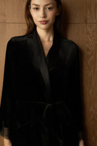 Model in the Rome Velvet Lace Robe, displaying the elegant black velvet sheen and classic shawl collar.