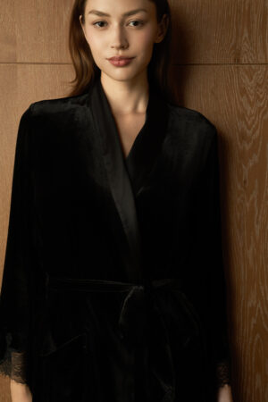 Model in the Rome Velvet Lace Robe, displaying the elegant black velvet sheen and classic shawl collar.