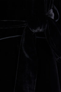 Detail shot of MANITO velvet robe for men waist tie, showing plush velvet texture and knot style.