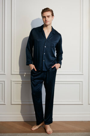 Model wearing navy MANITO Fragment Men's Pajama Set with button-down silk shirt and pants.