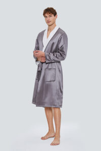 Model wearing gray MANITO silk terry cloth robe for men with white collar, posed against light background.