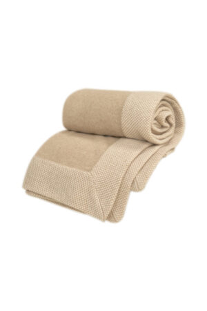 Folded Sand Dune Knit Throw Blanket, showing its dense knit structure and refined craftsmanship.