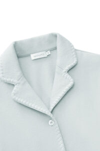 Close-up of Shell Baby's Silk Wool Pajama Set showing lapel collar, fine stitching, and soft silk wool fabric.