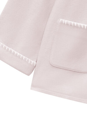Detail of Shell Baby's Silk Wool Pajama Set with delicate embroidered trim on cuffs and pocket edges.