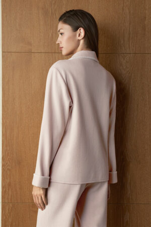 Close back view of woman in pink Shell Silk Wool Pajama Set, highlighting smooth drape and softly structured collar.
