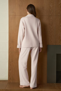 Back view of woman in pink Shell Silk Wool Pajama Set, showing relaxed pants and clean lines for comfortable nightwear.