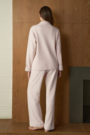 Back view of woman in pink Shell Silk Wool Pajama Set, showing relaxed pants and clean lines for comfortable nightwear.