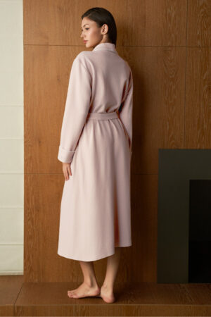 Close back view of woman in pink Shell Silk Wool Robe, midi length and sash belt creating a clean silhouette.
