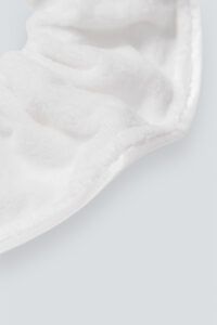 Close-up of MANITO Silk Terry Scrunchie, emphasizing the plush texture and detailing of the fabric.
