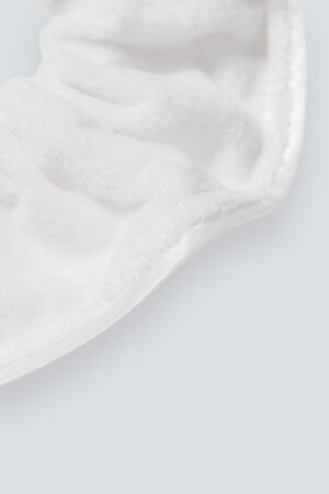 Close-up of MANITO Silk Terry Scrunchie, emphasizing the plush texture and detailing of the fabric.