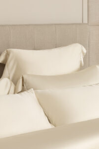 Layered silk pillows and duvet from MANITO Silver Wire Silk Duvet Cover collection, offering a plush, sophisticated bedding experience.