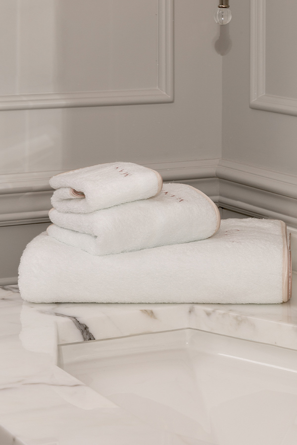 MANITO Soft Feeling 3 Pieces Bath Towel Set displayed on marble countertop, soft and fluffy cotton towels with silk trim.