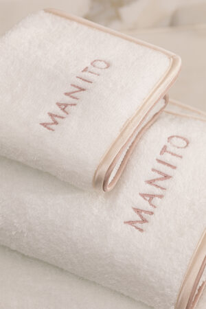 MANITO Soft Feeling 3 Pieces Bath Towel Set with detailed embroidery and beige silk trim, showcasing refined craftsmanship.