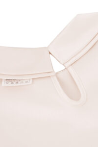 Back collar design of MANITO Sophia Baby Romper with keyhole button closure.