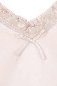 MANITO Sophia Kid's Nightdress neckline close-up showing delicate silk bow and stitching.
