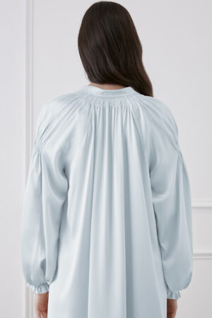 Close-up of back detail of Sophia midi dress, showcasing pleated design and lantern sleeves.