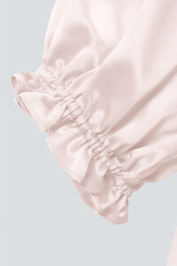 The cuff detail of MANITO Sophia silk nightdress in an ballet pink color.