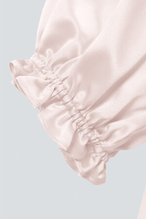 The cuff detail of MANITO Sophia silk nightdress in an ballet pink color.